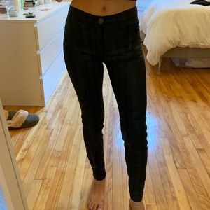 Coated black denim jeans